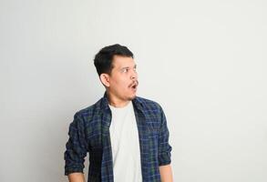 oh Wow, Omg. Portrait Of Surprised Asian Guy Opened Mouth In Amazement, Shocked Young Man Looking Stunned And Impressed, Emotionally Reacting To News photo