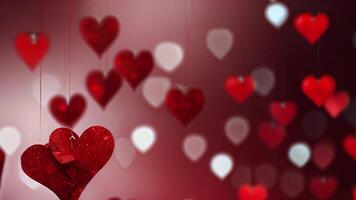 This features a bunch of red heart -shaped balloons hanging on strings against a red background. The hearts are of different sizes and are arranged in a staggered pattern. video