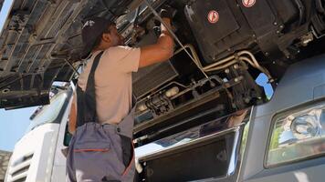 Truck mechanic working in vehicle repair service video
