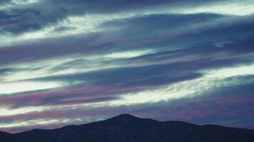 Silhouette Of Mountains With Clouds Passing In Winter Time Lapse video