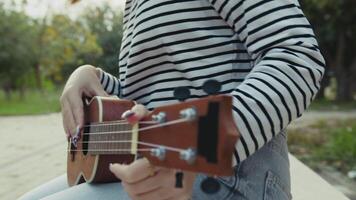 Hands Girl Practices First Lessons Of Ukulele Musical Stringed Instrument video