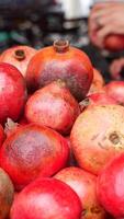 Fresh Pomegranates Beautifully Piled Up in a Market Display for Sale video
