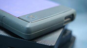 stack of external hard drives on table video