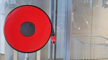 A red fire hose reel is installed in a modern building, emphasizing safety and emergency readiness video