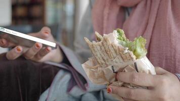 Savoring a Quick Snack While Engaged with a Smartphone Device video