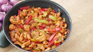 Delicious StirFried Chicken with Colorful Bell Peppers and Onions in a Pan video