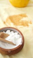 Baking soda and whole lemon on table video
