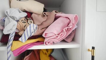 A Beautiful and Colorful Collection of Neatly Folded Clothes in a Closet video