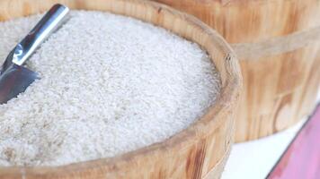Baskets filled with White Rice accompanied by a Metal Scoop, ideal for various Culinary Uses video