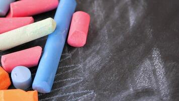 Vibrant and Colorful Chalk Pieces Arranged Neatly on a Blackboard video