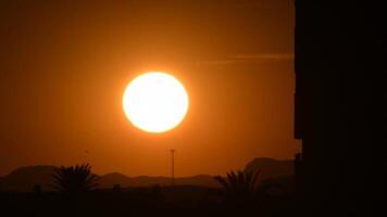 Sun hiding in sundowning in time lapse video