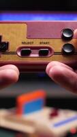 vertical pov Gamer playing with retro game console and controller video