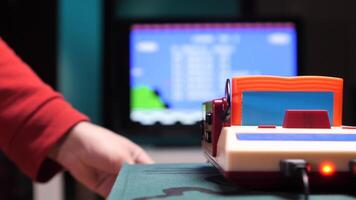 Gamer inserting cartridge into retro game console at home. concept game over video