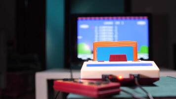 Old game console running, displaying a platform game on a crt tv video