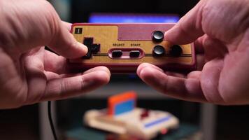pov Gamer playing with retro game console and controller video