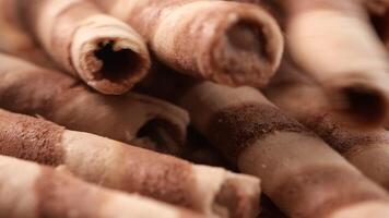 Indulge in the Delicious Chocolate Wafer Rolls Presented on a Rustic Background video