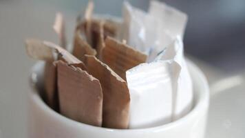 white sugar in a paper packet on table video