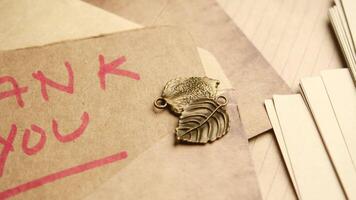 thank you message and envelope on wooden table video