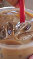 Enjoy a Refreshing Iced Coffee, complete with Ice Cubes in a Clear Glass for your delight video