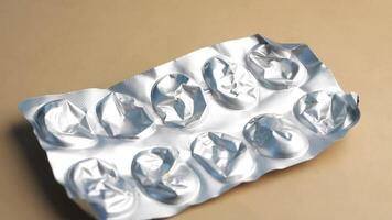 Close up of empty pills of blister pack on table video