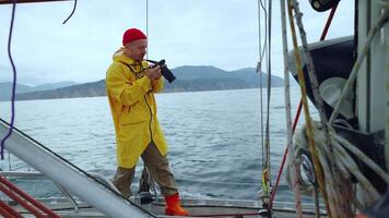 Man Travelling By Boat And Taking Photos Of Amazing Scenery On Coastline Of Kamchatka video