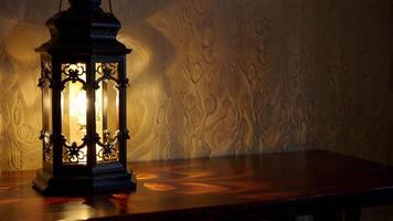 Illuminated Gothic Lantern on Rich Wood Table video