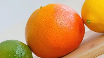 Citrus Symphony Fresh Lime Orange and Lemon on a Wooden Table video
