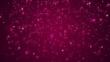Shiny twinkling stars and bokeh particles on a dark red magenta gradient. This elegant glittering event background is perfect for projects celebrating romance, luxury, or special occasions. video