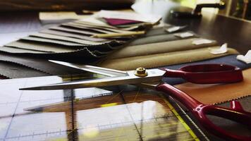 Scissors and Colorful Fabric Palette Examples in The Tailor Shop video