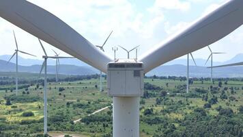 a large wind turbine with a blue sky in the background video