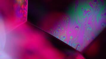 Bright reflection of liquid in macro, pink color, bubbles in macro, dark copy space, surreal water reflections video