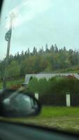 View from the window of the mountains in the car's rearview mirror. Travel by personal car, concept. video