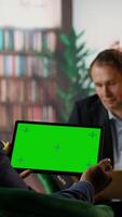 Vertical Team of skilled agents engaging in a strategic meeting with chroma key screen, emphasizing professionalism and discretion in a government mission. CIA staff gathering data. Camera A. video