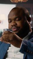 Vertical High society billionaire drinking whiskey at the classy luxurious social club, enjoying a gathering with the upper class members. Elegant gentlemen with successful careers. Camera A. video