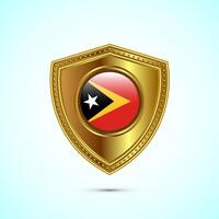 Rounded flag of East Timor with glossy gold shield vector