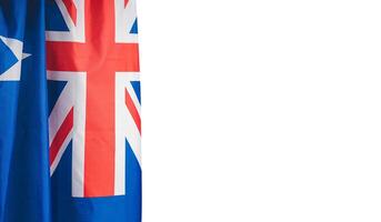 Close-up of the Australian flag is on the left side on a white background photo