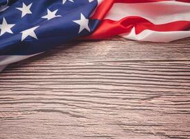 Top view of the American flag on a wooden table with copy space for text photo