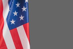 The American flag against a gray background with copy space for text photo