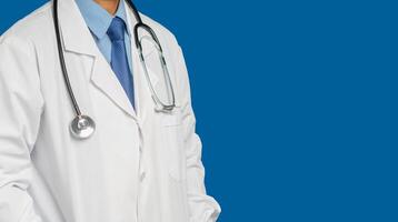 Midsection of a doctor in uniform standing while standing on a blue background photo