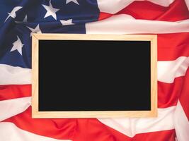 Top view of a mini chalkboard over the American flag background photo