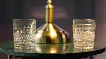 Timeless refined library at the elite social club with green chairs and whiskey glasses, elegant decor captures a calm atmosphere of heritage, aristocracy and sophistication. Close up. video