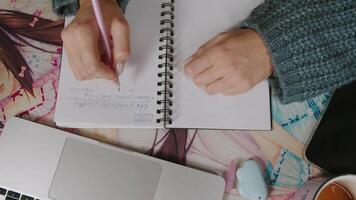 Writing Notes in Notebook on Desk video