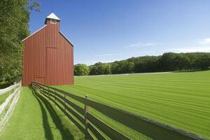 A serene landscape featuring a red barn beside a lush green field and wooden fence. photo