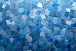 A mosaic of various shades of blue stones arranged in a decorative pattern. photo