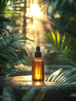 A glass dropper bottle sits on a stone amidst lush greenery, illuminated by soft sunlight. photo