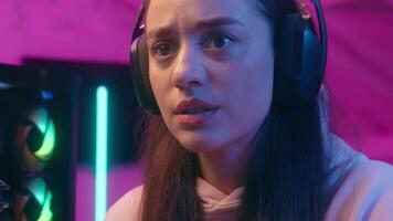 Angry mad aggressive emotional yelling Caucasian woman female girl user gamer streamer talking microphone talk to mic typing keyword stream computer lost failure playing online game streaming video