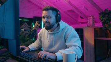 Caucasian man male guy gamer streamer addiction tired exhausted yawning need sleep sleepy play online game addict playing internet computer at night neon light indoors sport streaming insomnia video