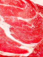 Close-Up of Fresh Marbled Beef Steak with Rich Red Color and Intricate Fat Patterns photo
