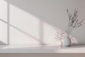 White vases with flowers on a shelf in front of a window photo