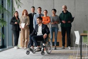 Multiethnic Business Team Collaborating in a Modern Office with Director in a Wheelchair photo